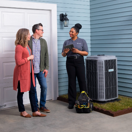 hvac tech talking with couple