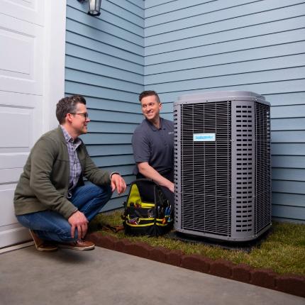 HVAC tech talking with homeowner
